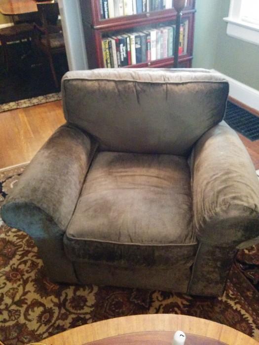 One of a pair of upholstered armchairs, from Pottery Barn
