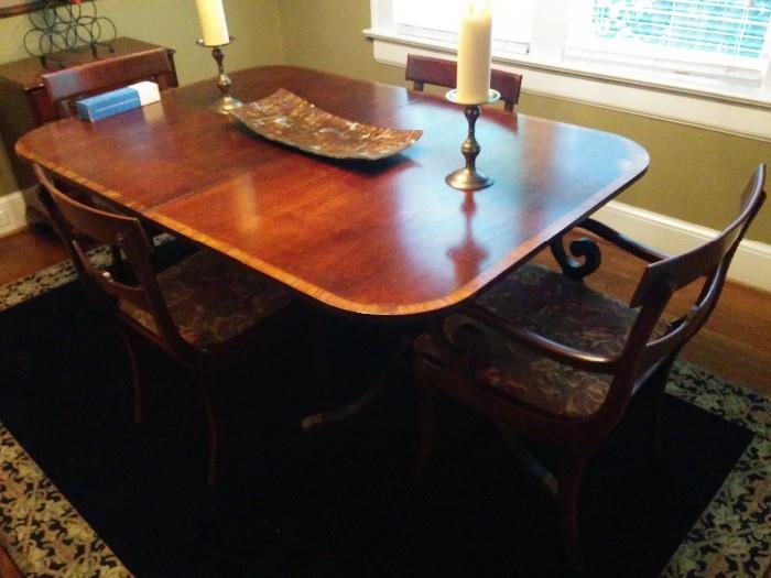 Banded mahogany dining room table, with 5 side chairs and one armchair