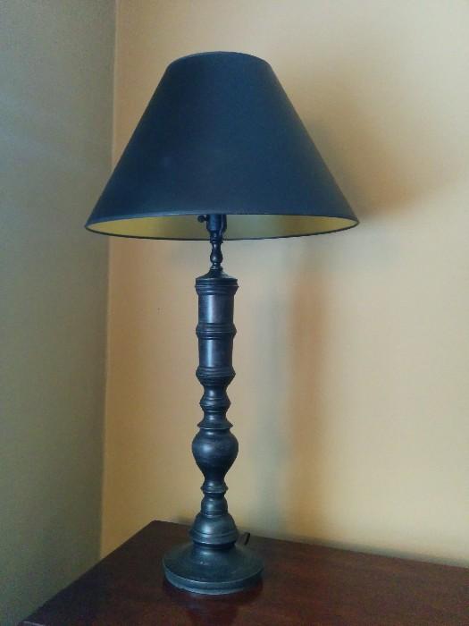One of a pair of substantial black metal table lamps
