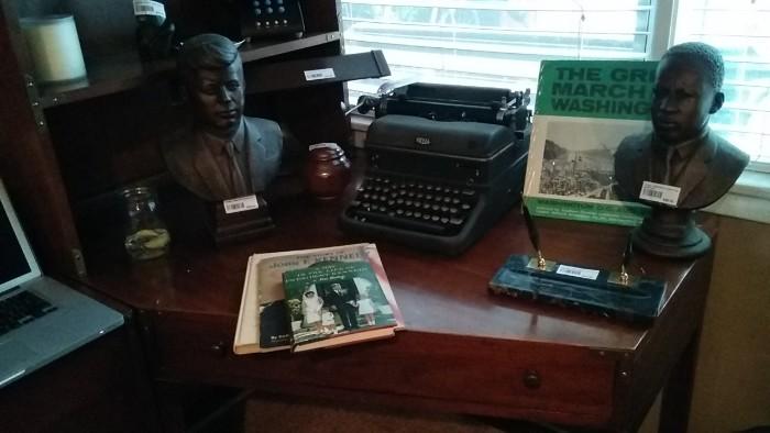 Cool 1960's, mid-century busts of MLK, Jr. & JFK, along with JFK books and album of MLK's walk on Washington. Also, vintage Royal typewriter, 1930, veined marble magnetic double pen holder.