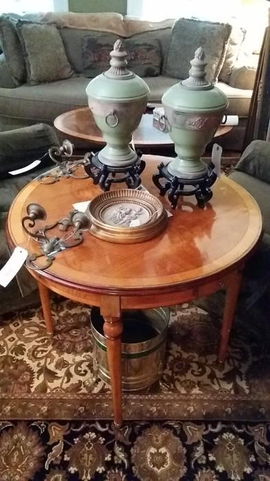 Antique French game table, with four drawers, the best piece of furniture in the entire house. Pair of celadon green vases and a great pair of antique brass sconces