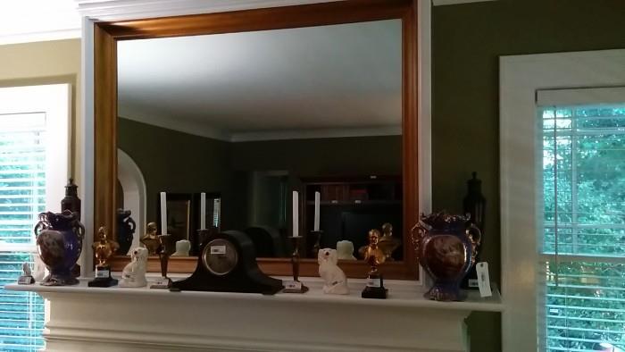 Mantle jewelry: Staffordshire puppies, pair of urns, Napoleon busts, mantle clock, pair of brass candlesticks