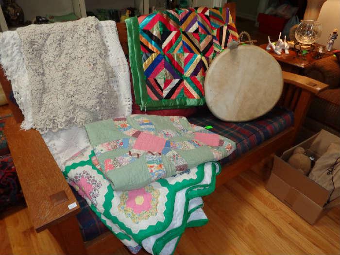 Mission oak sofa, antique quilts, native American drum, antique lace table cloths