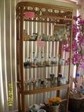 rattan book case and knic knacs ( one of two)