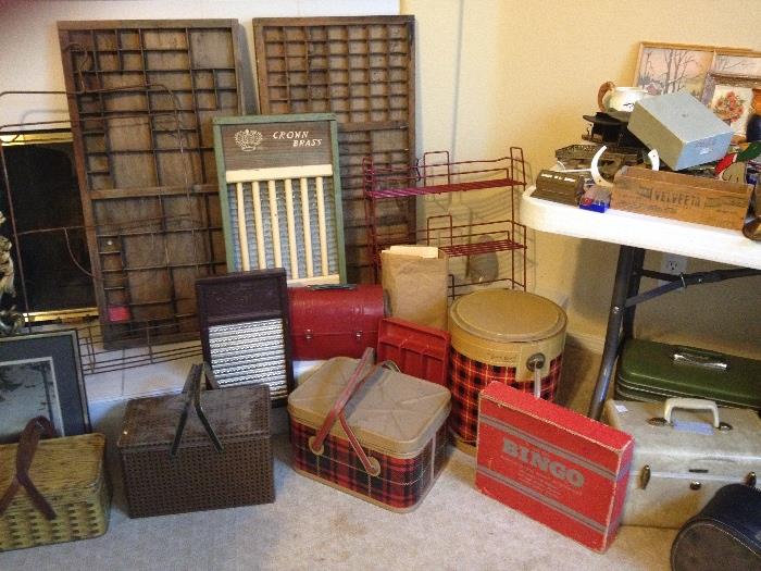 Lots of vintage tin; picnic baskets, canisters, trays, etc.