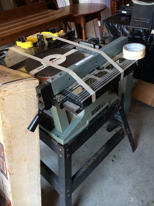                   Table saw with stand and blades