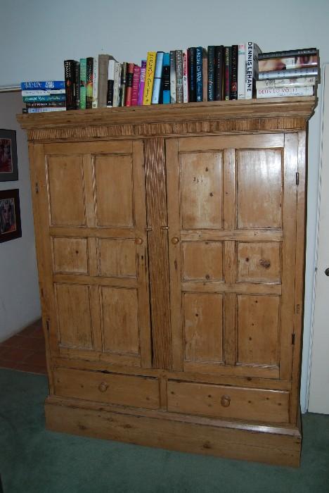 Two door closet with two drawers, shelves inside