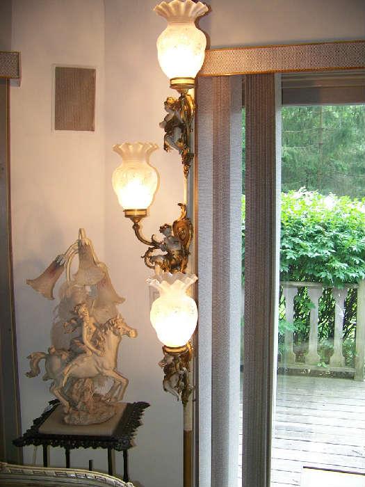 This is beautiful- bronze Cherubs on an adjustable pole lamp-