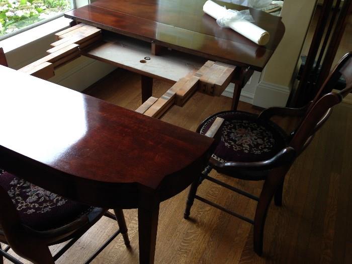 This is the game table opened up - it measures 40"wide x 40"l x 30"h then add up to 3 13" leaves to extend its size.  Perfect condition, belonged to the homeowner's grandmother.