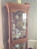 one of a pair of lighted curio cabinets made by our client