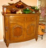 Bow-front oak buffet, Depression glass