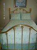 Full-Size Brass Bed, complete with mattress, pillows, and bedspread 