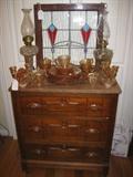 ANTIQUE DRESSER WITH CARNIVAL IRIS/HERRINGBONE DEPRESSION GLASS
