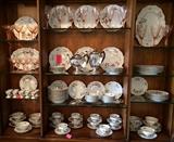 Gorgeous china set, pink crystal stems, silver plate coffee and tea pots.