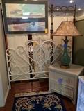 White wicker headboard, Lexington nightstand, ceramic lamp, art.