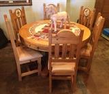 Fantastic pine and tile dining table with 6 leather upholstered chairs.