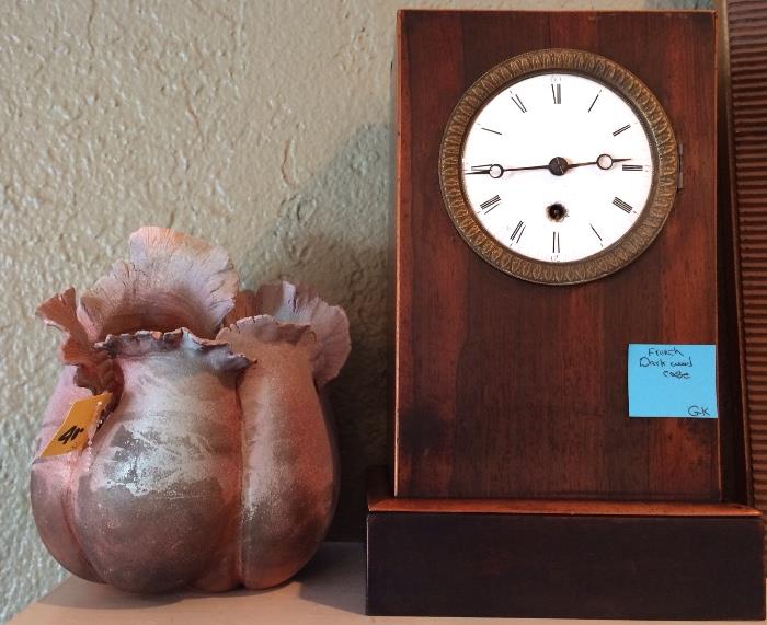 Studio pottery and antique French clock.