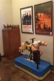 Vintage oak file cabinet, framed movie posters, and THUNDER -- a vintage mechanical horse in great working condition.