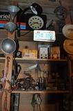 Gabriel sign with clock, antique tools, gauges, pulleys, old license plates, vintage ice skates, hub caps from yesteryear