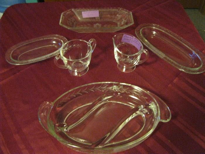 This sale has many pieces of vintage etched glass.