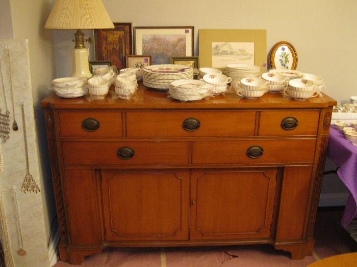 A Century Buffet with several drawers and doors to hold your best.  