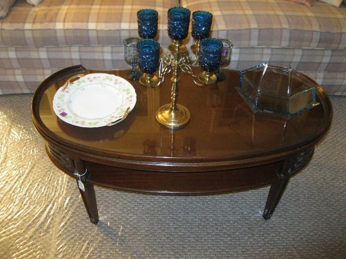 I was told this attractive coffee table with glass top originally belonged to the decedent's mother.