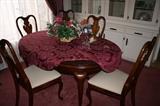 Dining table with extra leaf and table pads, six chairs  $400