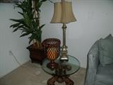 Small table in master bedroom used as a nightstand; one of a pair of lamps