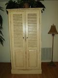 Distresses Armoire - used for clothing or media.  Matching 2 small tables/night stands in family room