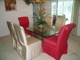 Dining table with fancy glass top and 6 Parsons chairs