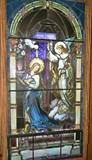 This stain glass window is in a frame that removes from in front of the original window. Stain glass with frame measures 6' 2 1/4" long.