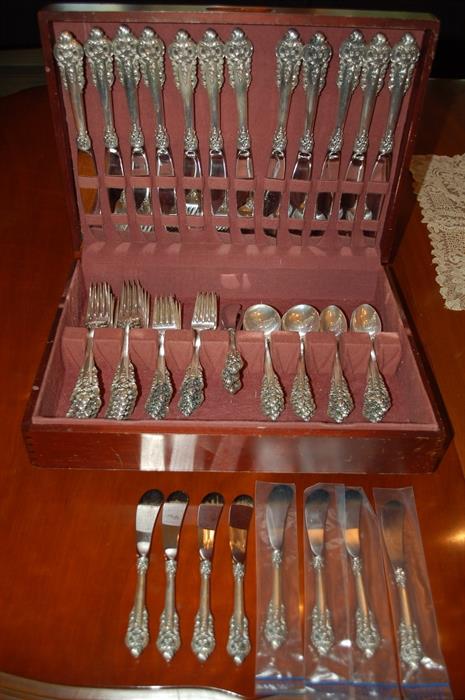 72 pieces of  Wallace Bros. “Grand Baroque” sterling flatware