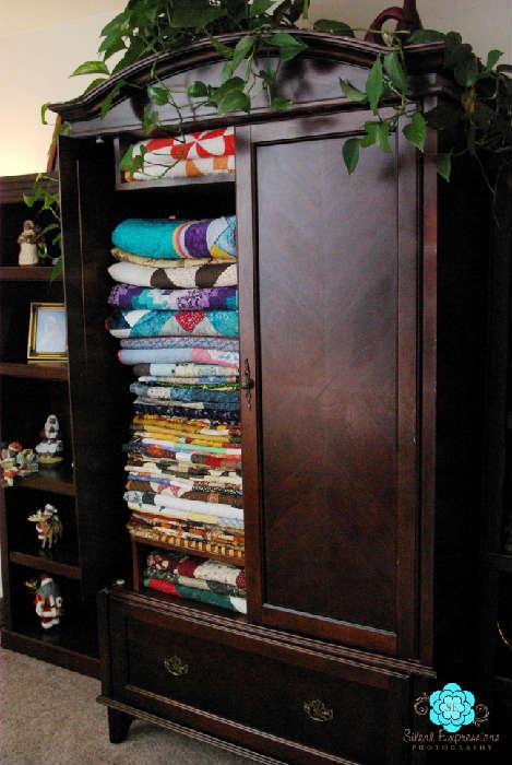 Large TV Armoire used to store quilts!  Lots of quilts!
