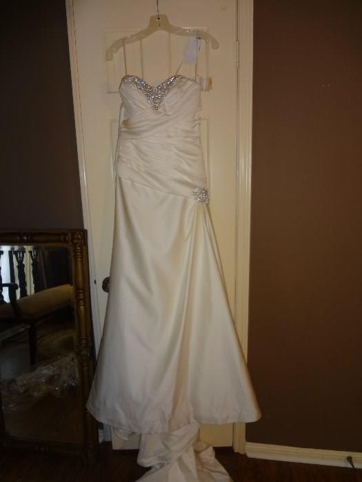 New with the tags wedding dress.  Size 10