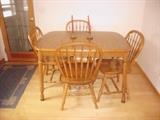 Solid oak table with leaf. Heat resistant top 4 chairs