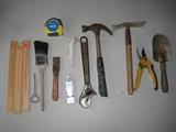 Hyde razor scraper, 1 in. Stanley scraper, K-Lux hand tool, paint can opener, 3 paint stirrers, 12 in. claw hammer, 12 in. Crescent wrench, hand cultivator, hand shovel, and pruning shears.