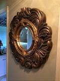 Rich, full ornate mirror.