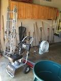 Two large ladders, power washer, yard today, cleaning supplies, large trash container.