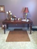 Lovely carved large desk/table, tall candlesticks, lamp.