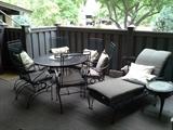 Patio furniture, 6 bouncy chairs, round table, chaise, cushions, pillows, antique iron side table.