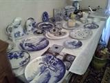 Collection of blue and white plates, pitchers, bowls, lamp.  Some antique, flo blue, some newer.