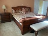 cherry sleigh bed with nite stand and bench and mans chest