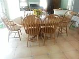 solid oak kitchen table 67" with 6 Windsor chairs