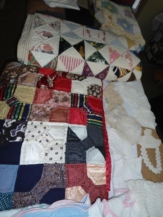 Table FULL of American Made Custom Hand QUILTS and also hand/made quilts from other countries....GREAT wallhangings..