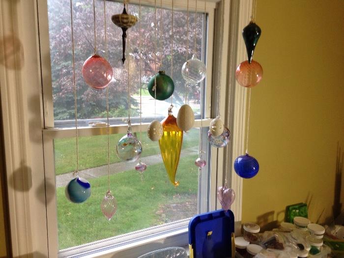 Quite a few hand blown glass globes to hang 