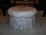 Master Bedroom-First Floor:  32" round blue plaid/check ottoman.