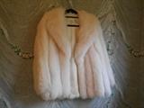 Master Bedroom-First Floor:  White  fox jacket (probably size 10-12).