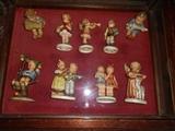 Living Room-SMALLS area:  A collection of HUMMEL figures are in a vitrine table.  Many have been SOLD but we have a couple left.