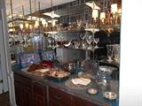 BUTLER'S PANTRY:  A collection of silver-plate and glassware.