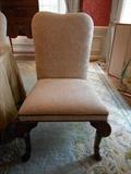 Dining Room:  One of four neutrally upholstered BAKER chairs with nail head trim.  These are NEW and never used by the client.  